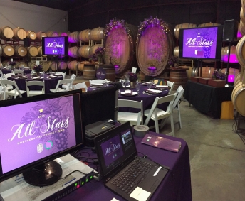 TV displays setup for dinner function at a San Francisco winery.