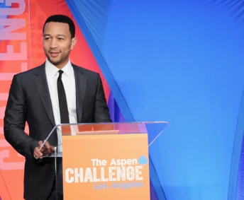 John Legend giving speech at education conference in Los Angeles.