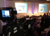 Video Camera pointed at two screens in a ballroom